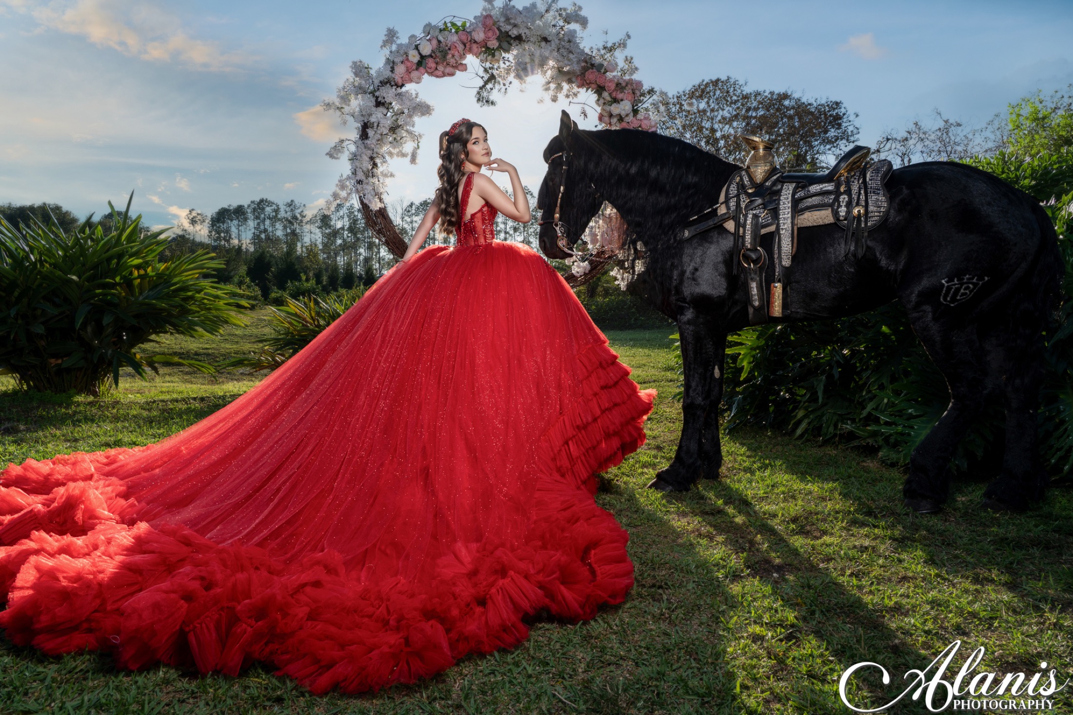Quinceañera in a dramatic red dress