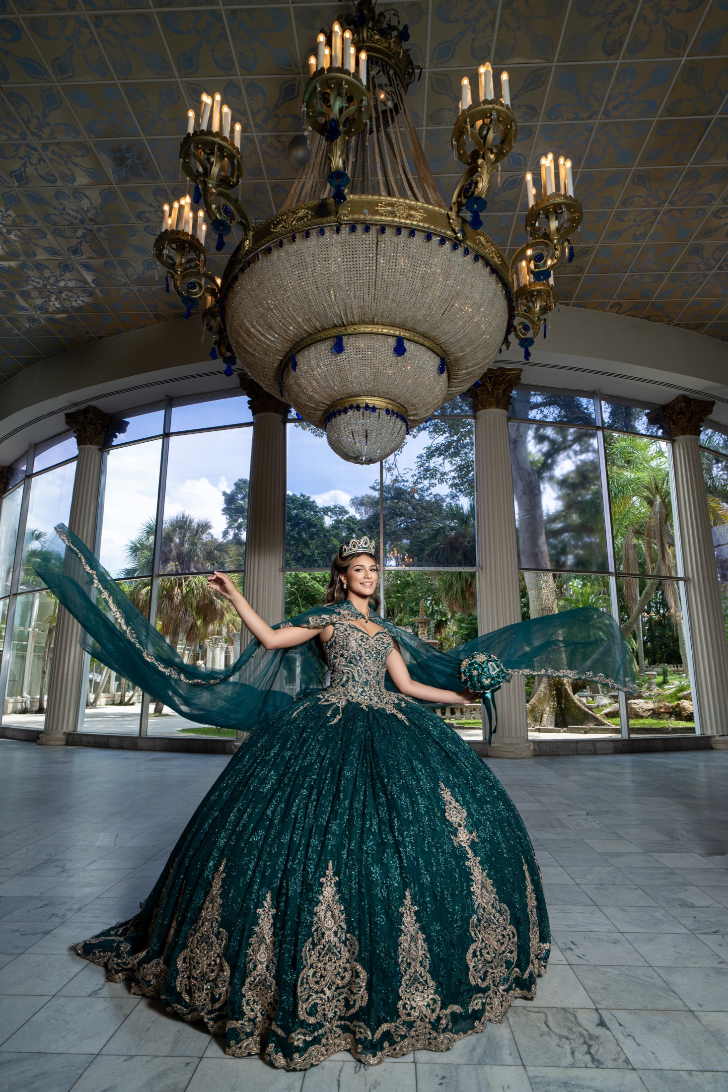 Quinceañera portrait in an emerald gown
